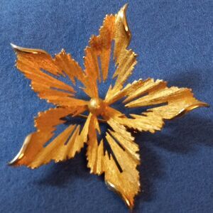 Gold tone metal Flower Brooch